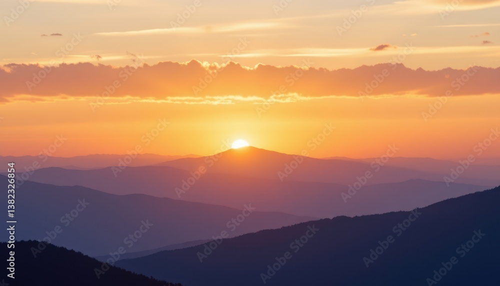 Obraz premium A tranquil sunset over a mountain range, where the sky is ablaze with soft, pastel colors and sparkling light effects.