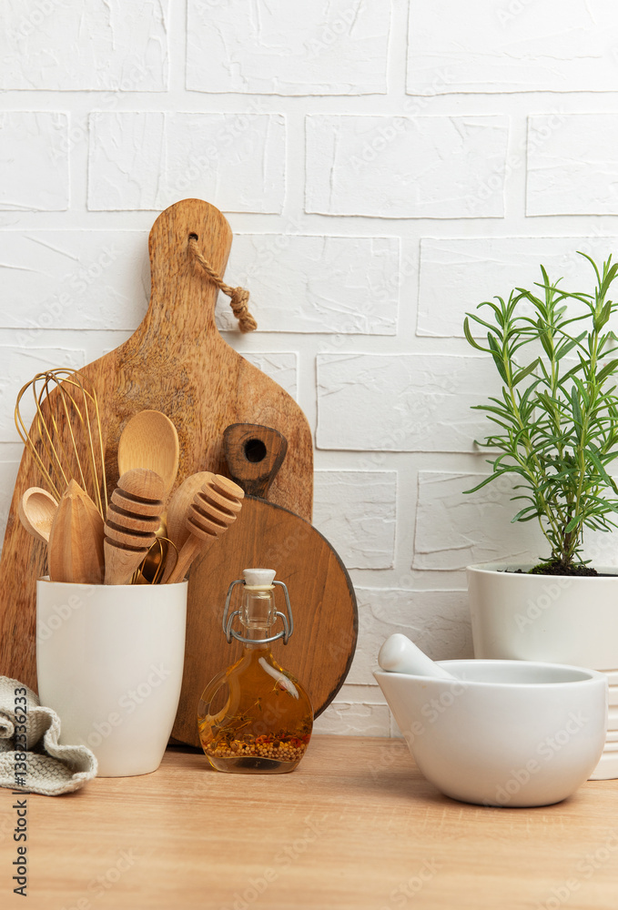 Kitchen utensils and rosemary plant creating a cozy culinary scene