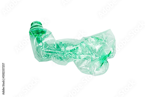 Crumpled green plastic bottle isolated, ready for recycling. Environmental concept, plastic waste.