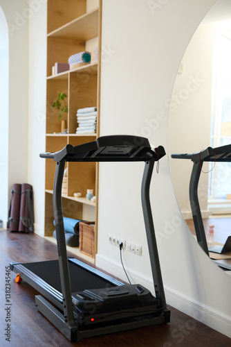 Wallpaper Mural Modern treadmill placed in bright, minimalistic home gym with wooden shelves and neatly organized items creating a clean, functional workout space Torontodigital.ca