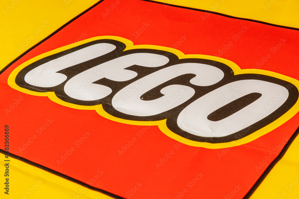 Obraz premium Colorful Lego logo on a bright yellow background
