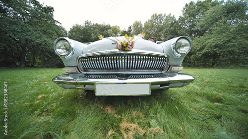 Photos Vintage volga m21 wedding car resting on grassy meadow, surrounded by delicate b