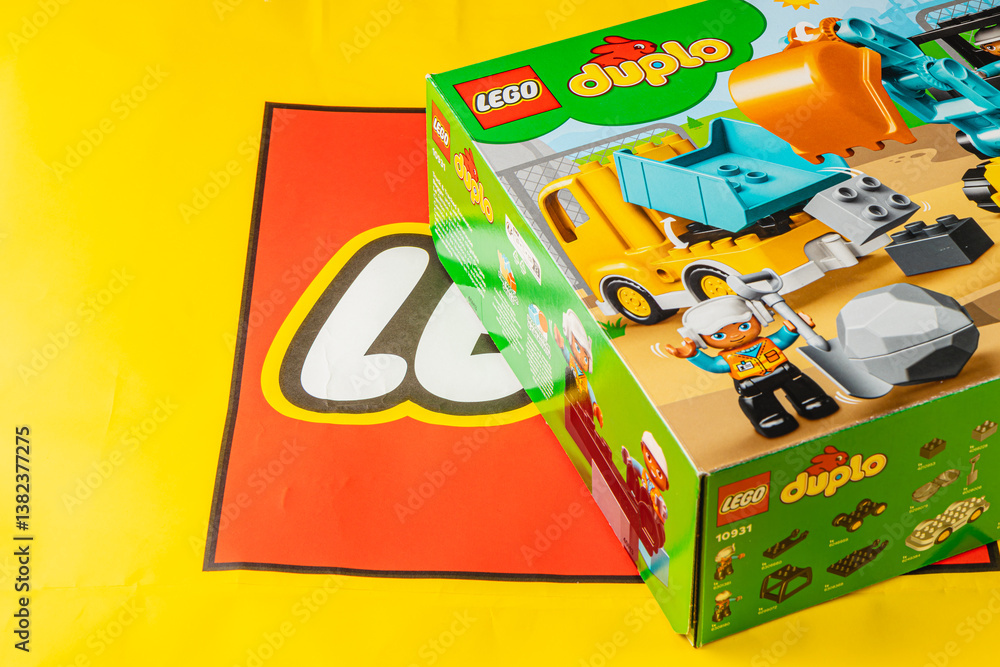 Obraz premium 24.03.25 Lviv UkraineColorful construction playset on bright yellow backdrop