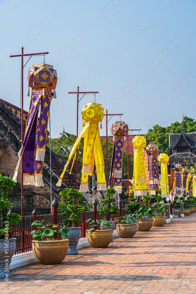 Lanna lantern and Prayer flags tung Hang or Northern traditional flag hang on sand pagoda in the Wat Chedi Luang temple for Songkran Festival is celebrated in a traditional New Year's in Chiang Mai