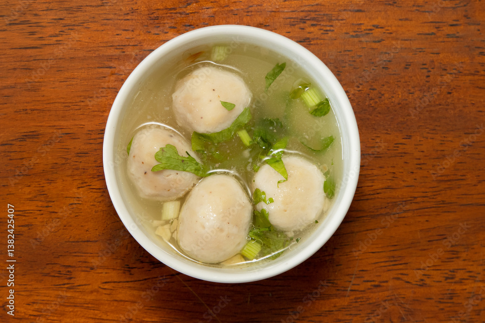 Delicious meatballs in broth capturing warm culinary moments