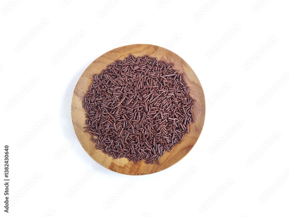 chocolate meshes on wooden plate isolated on white background with top view chocolate meshes on wooden plate isolated on white background with top view