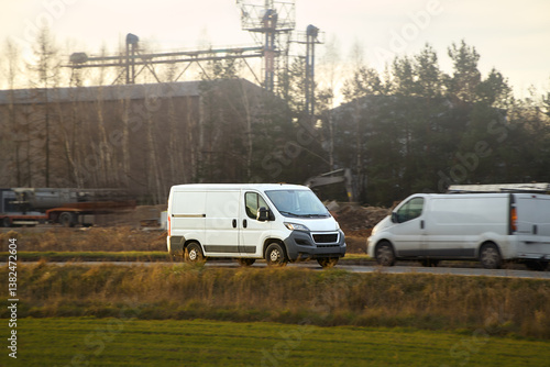 White transport van hauling goods