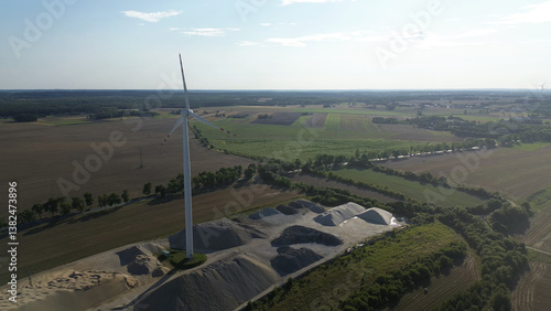 Obraz na płótnie Wind turbine in sunset sky background w salonie
