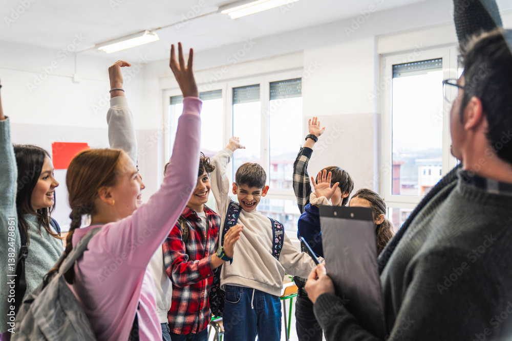 Fototapeta premium Cheerful students raising hands enthusiastically while answering their teacher's question in a lively classroom setting
