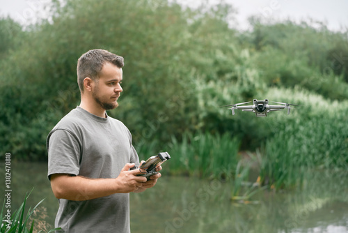 Obraz na płótnie Smiling man piloting drone with visual line. w salonie