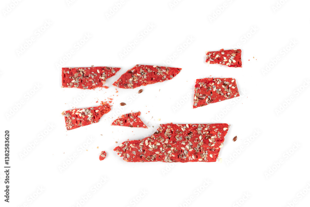 Fototapeta premium Beetroot crackers, thin rusk beet root bread, red diet multigrain crispbread, various seeds