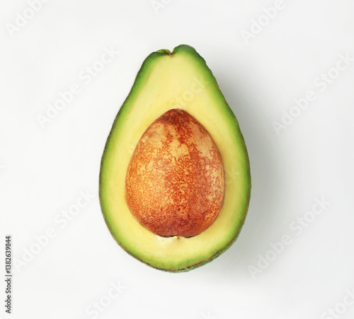 Avocado slice with a stone. On a white background