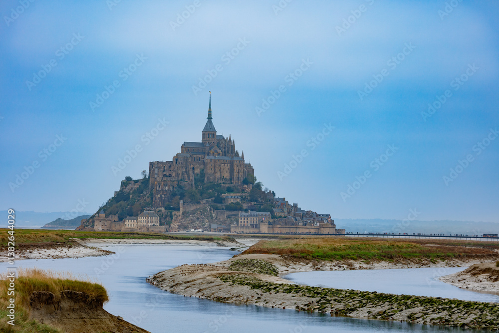 Grand stone fortress silhouetted against the sweeping clouds