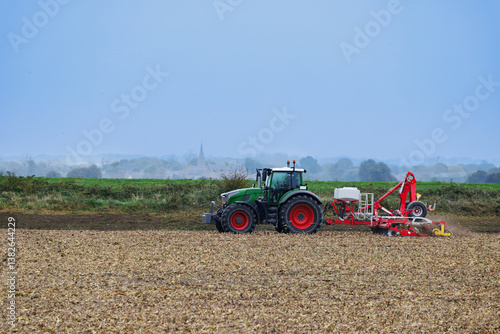 Obraz na płótnie Tractor in Normandy countryside, cultivating the field, France w salonie