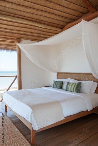 Obraz na płótnie A bed with a white canopy and pillows. The bed is in a room with a wooden floor and a view of the ocean w salonie