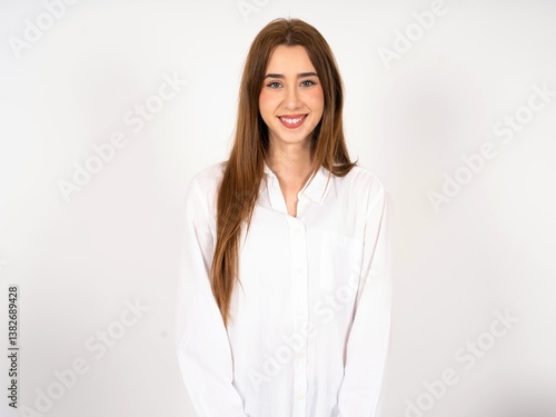 Close up photo of Caucasian young girl wearing white shirt toothy smiling