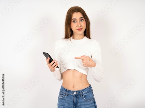 Caucasian young girl wearing white T-shirt holding in hands showing new cell,