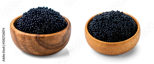 Black caviar fish roe in the wooden bowl isolated, Black tobiko in the small wood bowl,