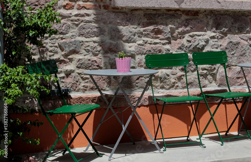 colorful, vibrant photographs taken on a summer day on Cunda Island. Green chairs, doors, walls. Vintage designs of restaurants and cafes in touch with nature.