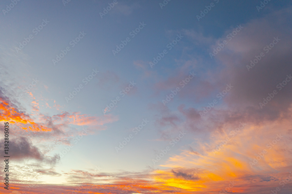 Fototapeta premium Aerial view clouds are moving slowly in the yellow sky at sunset..amazing cloud in yellow sky in beautiful sunset above the sea..colorful sky sunset or sunrise background.