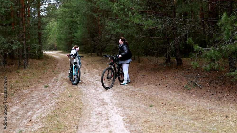 Biking adventure in the forest with children on a sunny day in autumn Biking adventure in the forest with children on a sunny day in autumn