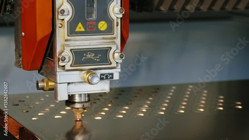 Cutting metal with a laser with sparks. Laser cutting technology close up