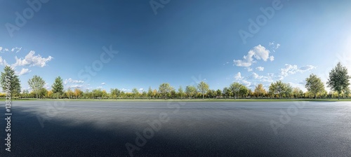 Empty asphalt road with trees and sky