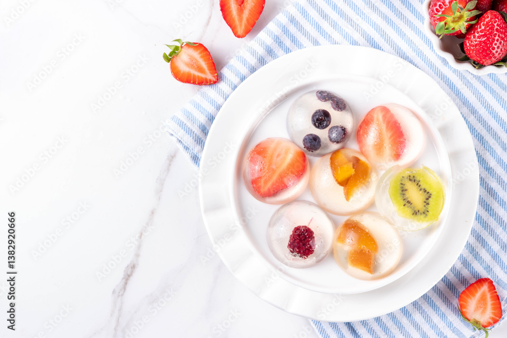 Fruit Raindrop Cake, or Mizu Shingen Mochi, clear jelly dessert Fruit Raindrop Cake, or Mizu Shingen Mochi, clear jelly dessert