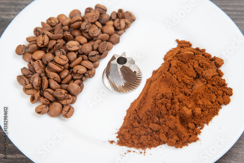 oasted coffee beans, a burr grinder, and ground coffee on a white background, showing the coffee-making process. Ideal for beverage and kitchen themes.