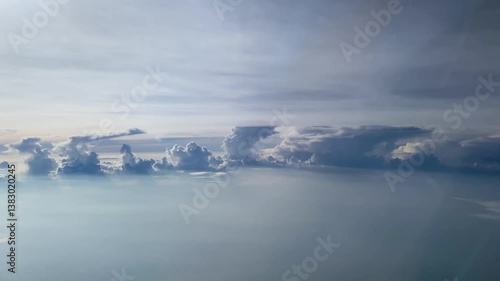 Flying above the clouds. Aerial view of clouds at sunrise. Traveling by air perfect background, 4k