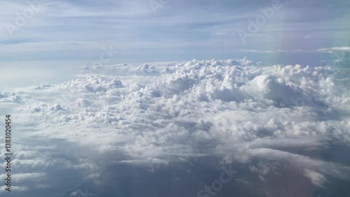 Flying above the clouds. Aerial view of clouds at sunrise. Traveling by air perfect background, 4k