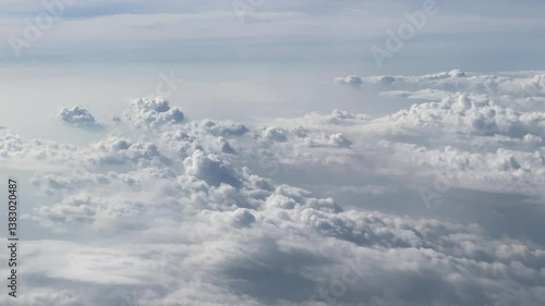 Flying above the clouds. Aerial view of clouds at sunrise. Traveling by air perfect background, 4k