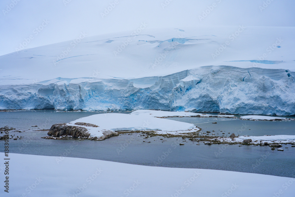 Charlotte Bay as seen from Portal Point, a narrow point on the Reclus Peninsula that served as a gateway to the continental plateau of Antarctica in 1956 when a refuge was established on its coast Charlotte Bay as seen from Portal Point, a narrow point on the Reclus Peninsula that served as a gateway to the continental plateau of Antarctica in 1956 when a refuge was established on its coast