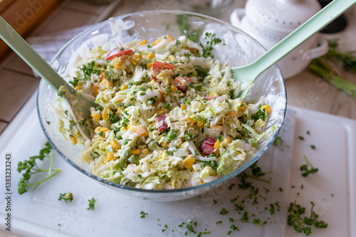 Chinese cabbage salad with peppers, onions, green peas in a delicious dressing. Tasty homemade barbecue salad