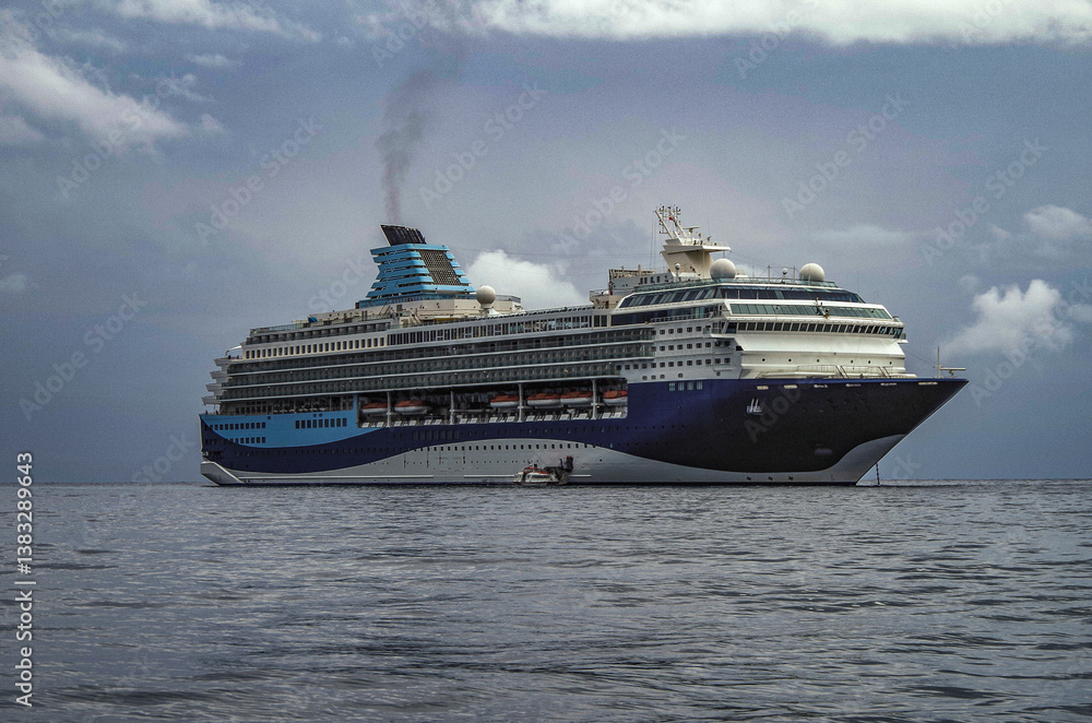 Modern ruiseship cruise ship liner Explorer 2 anchored offshore of Zakynthos island in Greece during Aegean summer Greek Island cruising on cloudy day