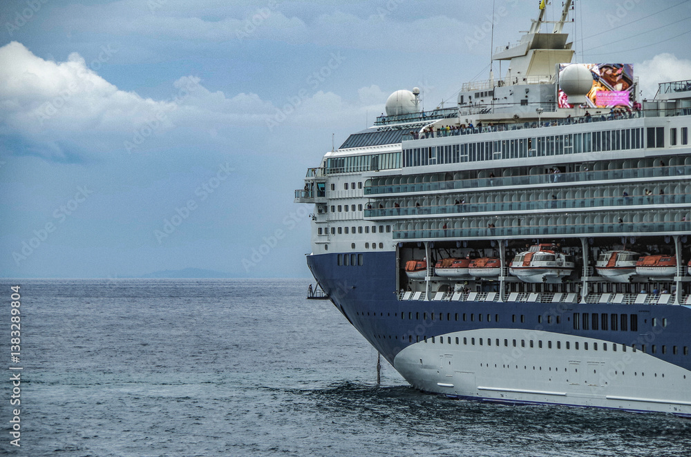 Modern ruiseship cruise ship liner Explorer 2 anchored offshore of Zakynthos island in Greece during Aegean summer Greek Island cruising on cloudy day