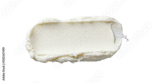 Close up view of a rectangular smear of white cream cheese against a solid black background space filling