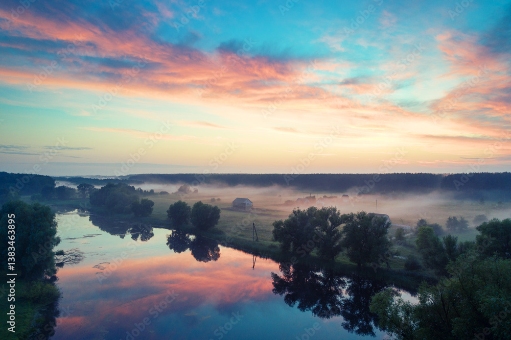 Magic sunrise over the lake. Misty early morning, rural landscape, wilderness, mystical feeling. Serenity lake in magical light