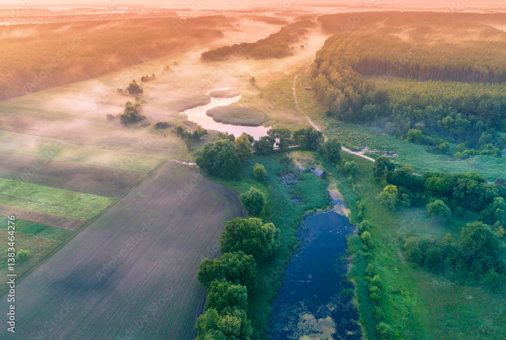 Magic sunrise over the lake. Misty early morning, rural landscape, wilderness, mystical feeling. Serenity lake in magical light