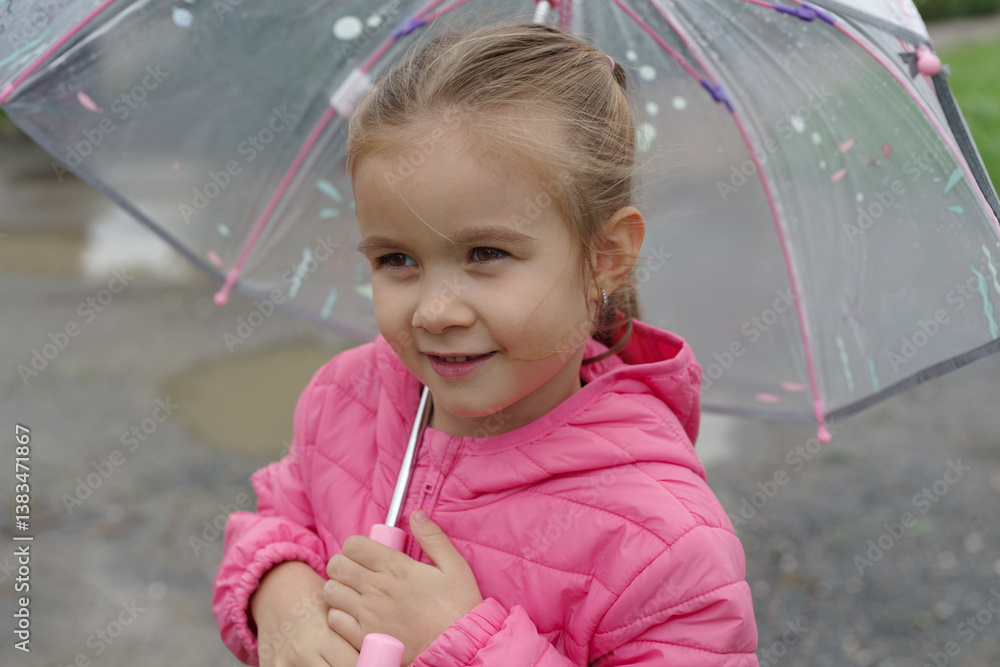 Little girl holding umbrella