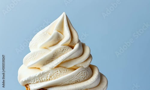 Close-up of a vanilla soft serve ice cream cone