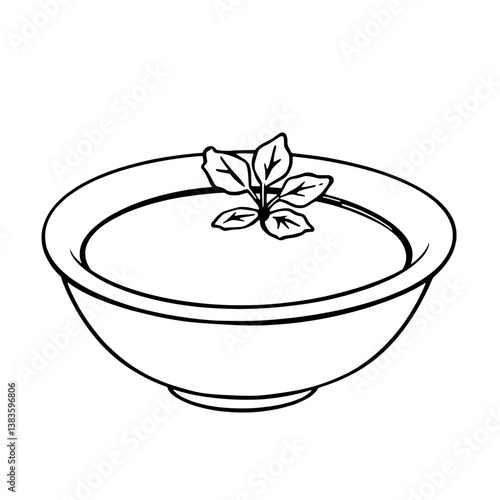 Creamy Yellow Soup in a Bowl with Fresh Herbs