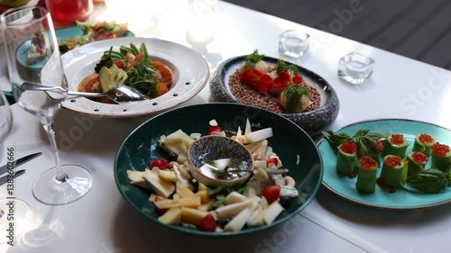 food drinks and salads meat dishes on the table in the restaurant