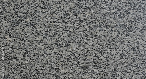 Granite stone texture surface background featuring gray and black spots