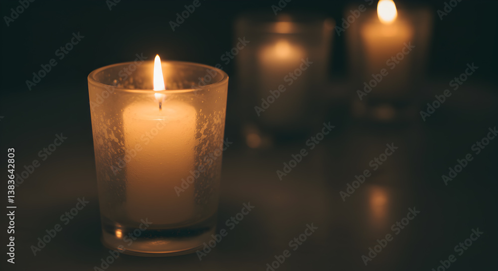 Single Lit Candle In A Frosted Glass Holder Displaying A Warm Ambience Single Lit Candle In A Frosted Glass Holder Displaying A Warm Ambience