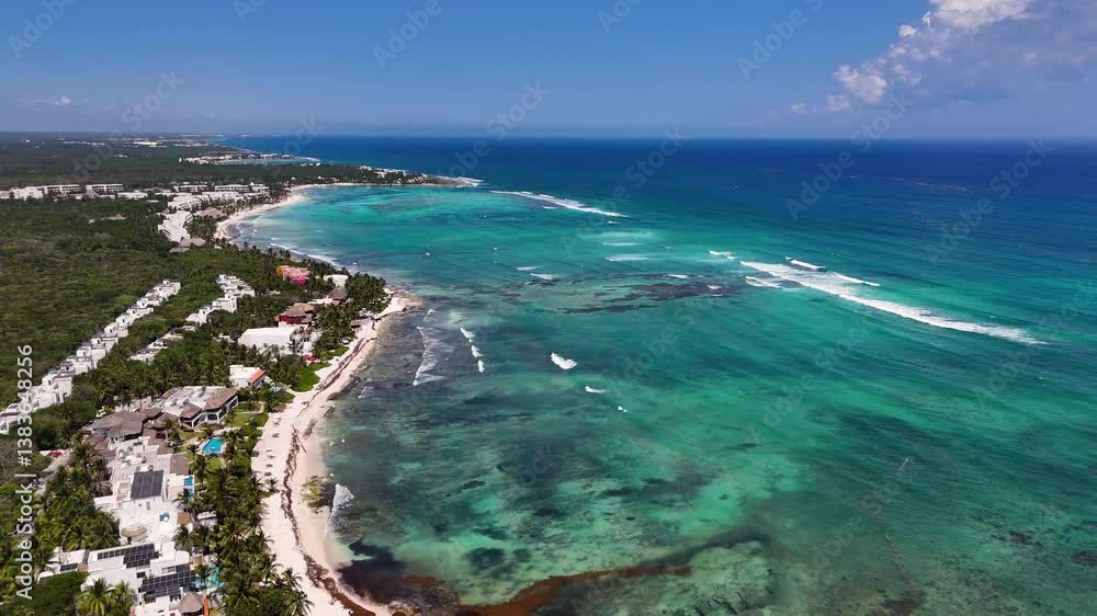 Aerial drone view of coastline in Mexico with blue Caribbean Sea with sargassum seaweed and white sand beach on a sunny blue sky day Aerial drone view of coastline in Mexico with blue Caribbean Sea with sargassum seaweed and white sand beach on a sunny blue sky day