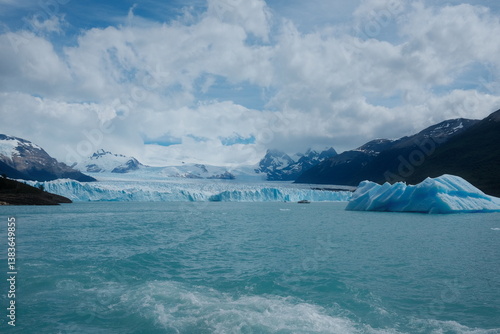 Wallpaper Mural Wide view of Perito Moreno Glacier in El Calafate, Patagonia, Argentina — turquoise lake, towering blue ice wall, and snowy mountain peaks in the background. Torontodigital.ca