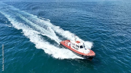 Wallpaper Mural Aerial drone cinematic tracking video of red pilot boat cruising in high speed in Mediterranean deep blue sea offering navigational aid to ships Torontodigital.ca