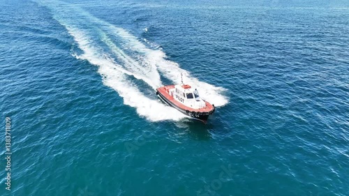 Wallpaper Mural Aerial drone cinematic tracking video of red pilot boat cruising in high speed in Mediterranean deep blue sea offering navigational aid to ships Torontodigital.ca