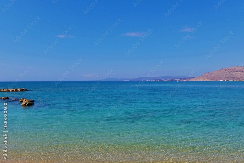 Beautiful beach, calm turquoise sea surface and distatn horizon. Calm ocean, distant orange sandy shore. Travel photography from the shoreline. Day on the beach, vacation photo. Beautiful beach, calm turquoise sea surface and distatn horizon. Calm ocean, distant orange sandy shore. Travel photography from the shoreline. Day on the beach, vacation photo.